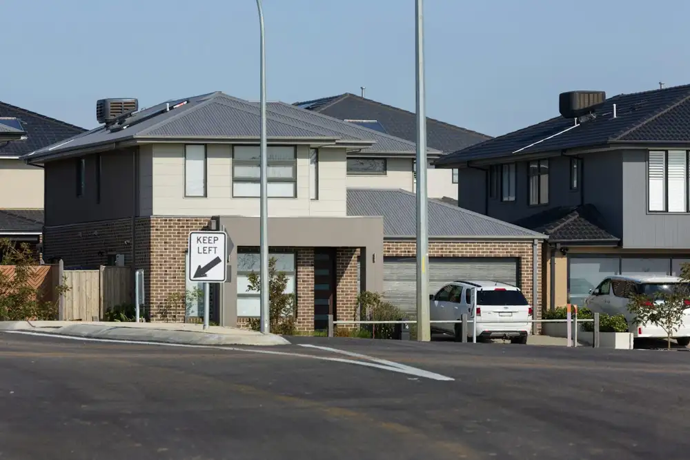 Street of new two-storey brick and render homes in an Australian estate